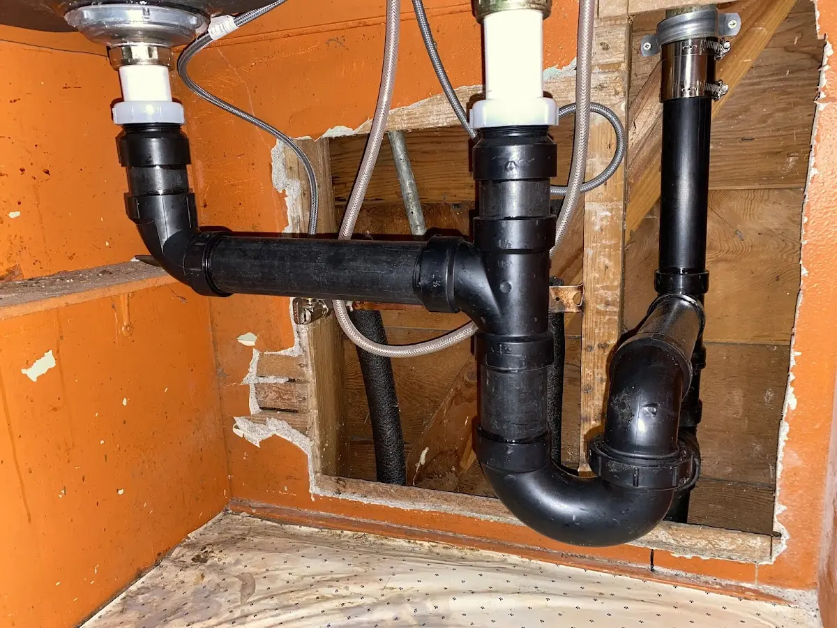 Professional Garbage Disposal Repair equipment and tools on the job in Sweeny